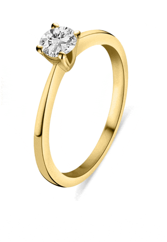 a yellow gold ring with a single diamond in the center