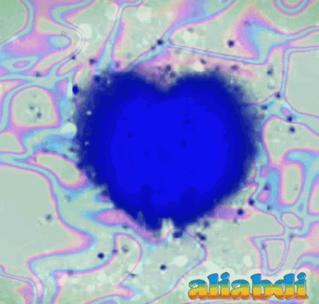 a blue heart in the middle of a colorful background with the name aliahdi written on it