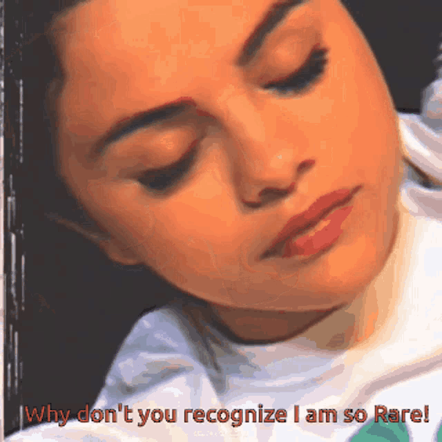 a close up of a woman 's face with the words " why don 't you recognize i am so rare " below her