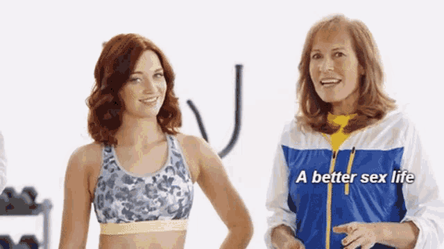 two women are standing next to each other and one of them is wearing a blue and white jacket that says a better sex life