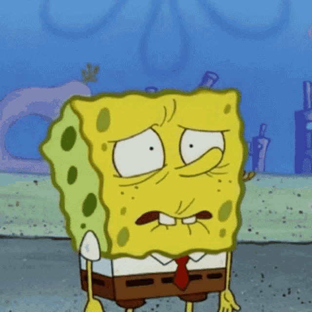 a cartoon of spongebob wearing a tie making a funny face