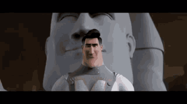 a man in a superhero costume is standing in front of a large statue .