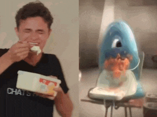a man is eating a container of ice cream next to a picture of a shark .