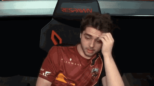 a man is sitting in a chair that says respawn