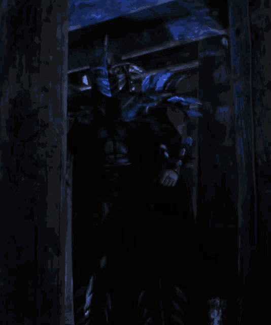a person in a dark room with a mask on