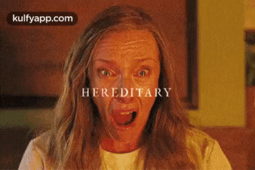 a woman is making a funny face with her mouth open in a movie .