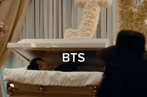 a coffin with the word bts on the top