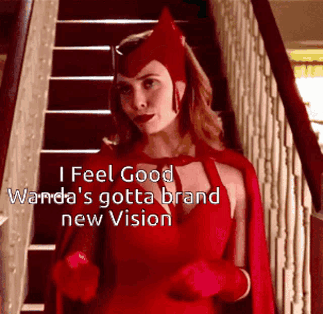 a woman in a scarlet witch costume is standing on stairs .