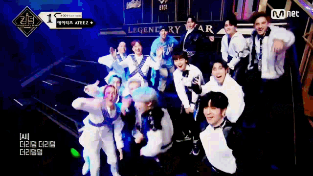 a group of people are posing for a picture in front of a sign that says legendary star