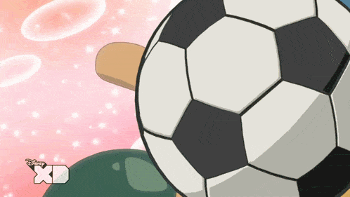 a cartoon of a hand holding a soccer ball with disney xd on the bottom right