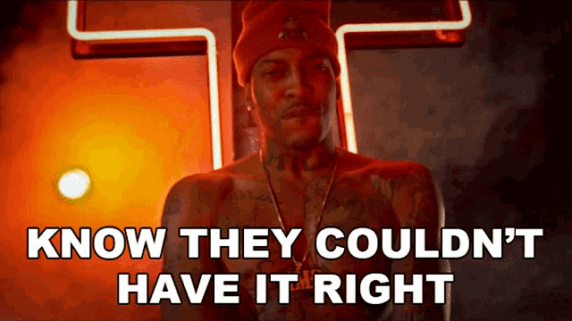 a shirtless man is standing in front of a neon sign that says " know they couldn 't have it right "