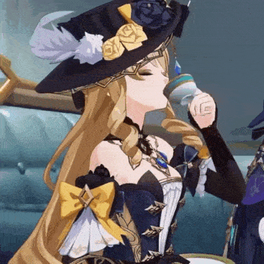 a woman in a witch costume is drinking from a glass .