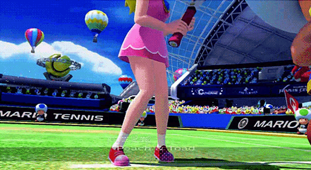 a girl in a pink dress is playing tennis in a video game