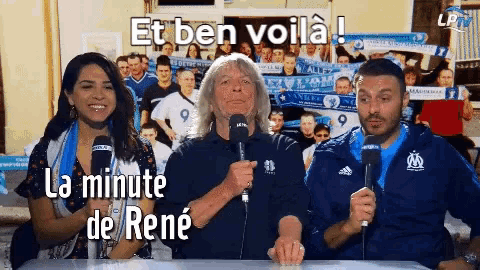 a group of people sitting at a table with microphones and the words " et ben voila "