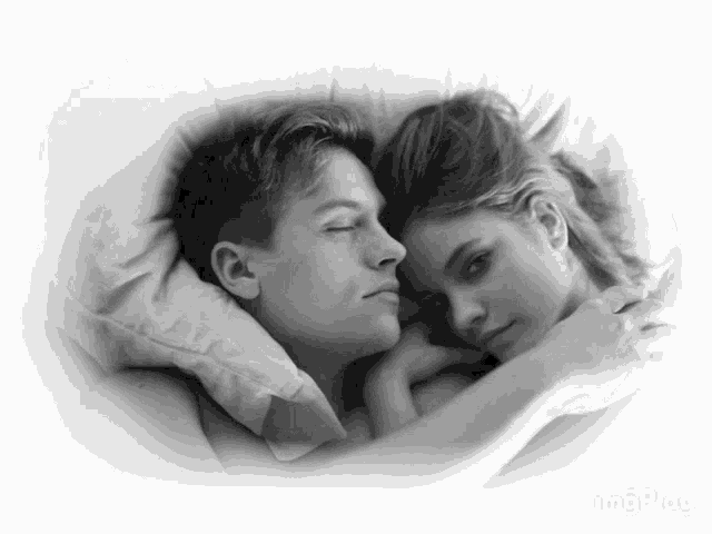 a black and white photo of a man and a woman hugging each other