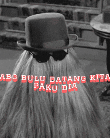a black and white photo of a person wearing a hat with the words " abg bulu datang kita paku dia "