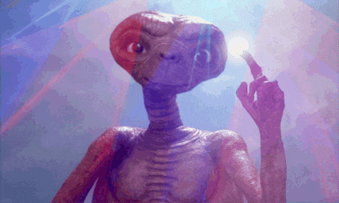 a close up of a purple alien holding a light bulb