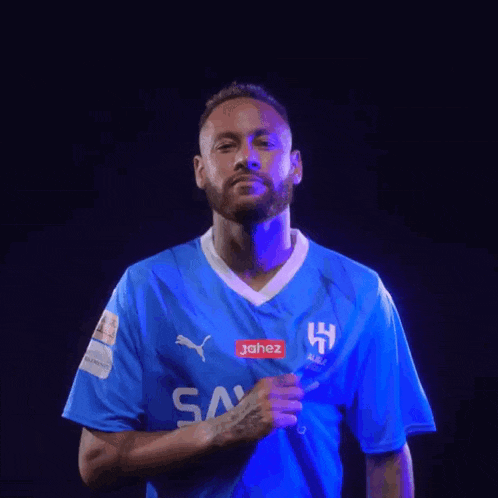 a man wearing a blue shirt that says jahez