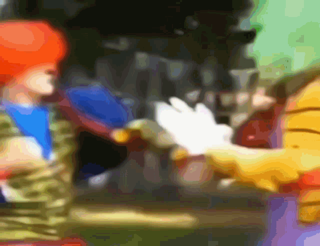 a blurry picture of mickey mouse giving a high five to a person