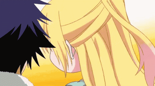 a boy and a girl are looking at each other with their eyes closed