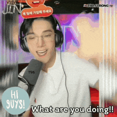 a man wearing headphones says what are you doing in front of a microphone
