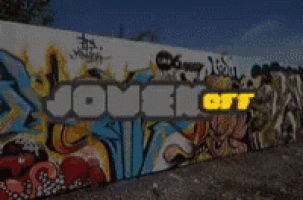 a wall with graffiti on it and the words jouer on
