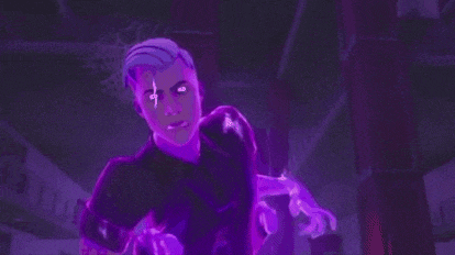 a man is standing in a dark room with purple lights coming out of his eyes .