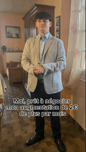 a man in a suit is standing in a living room with the caption moi pret a negocier mon augmentation de 2