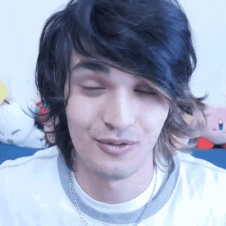 a close up of a person 's face with their eyes closed .