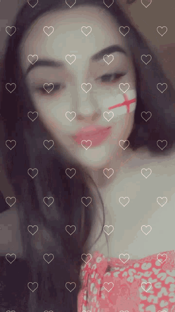a girl with a cross painted on her face