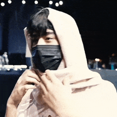a man wearing a mask and a scarf around his face