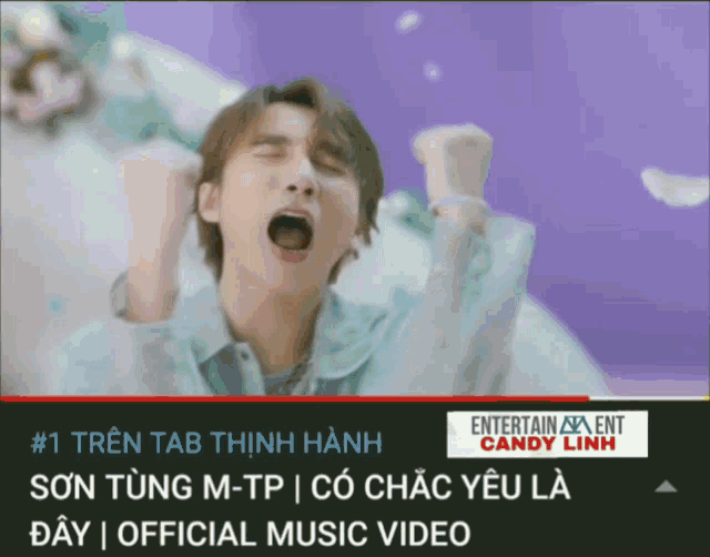 a man with his mouth open is on a screen that says entertainment candy linh on it