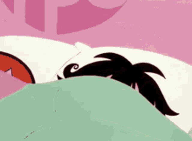 a cartoon character is sleeping in a bed with a green blanket .