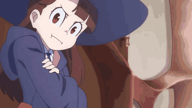 a cartoon girl with a blue hat and a purple robe