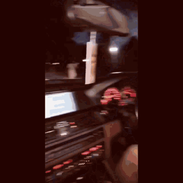 a woman is driving a car with her legs crossed while holding the steering wheel .