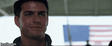 a close up of a man 's face with a flag in the background