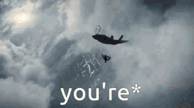 a plane is flying through a cloudy sky with the words you 're * above it .