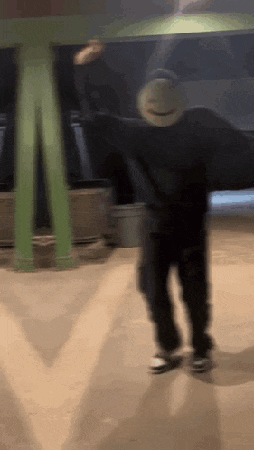 a blurry picture of a person wearing a dream mask .