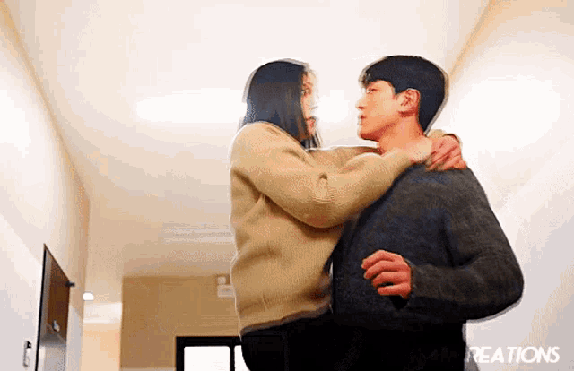 a man is carrying a woman in his arms in a hallway with the word reactions written on the bottom