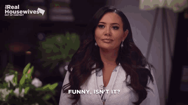 a woman says funny isn t it in front of a real housewives sign