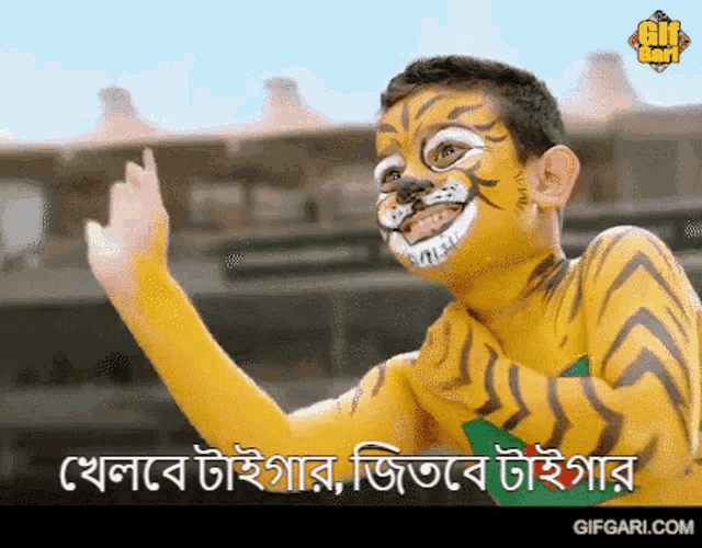 a boy with his face painted like a tiger is giving the middle finger
