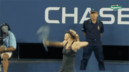 a tennis player is swinging her racket in front of a chase sign