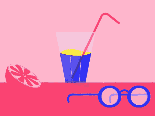 a glass of juice with a straw and a pair of glasses