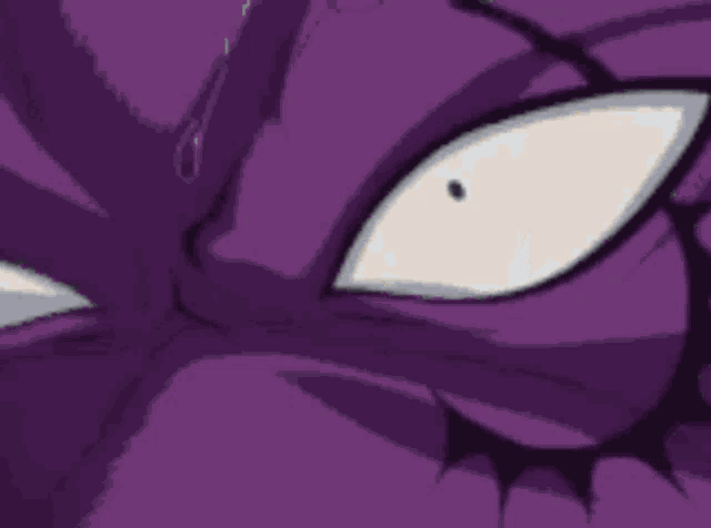 a man is standing next to a purple monster in a field .