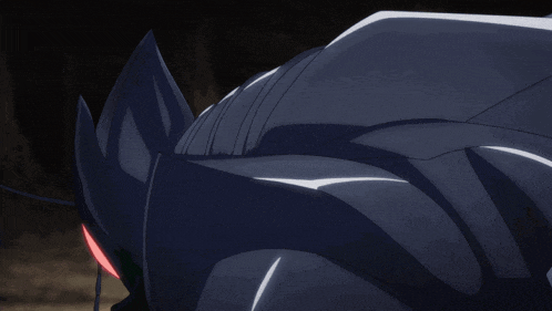 a gray and green monster with red eyes