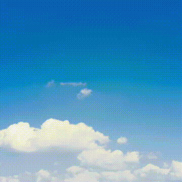 a blue sky with white clouds and a polka dot pattern