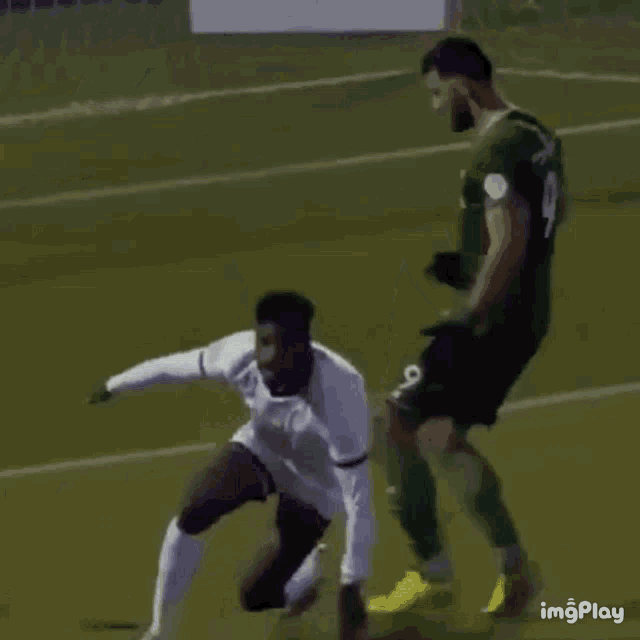 a soccer player in a white jersey with the number 9 on it