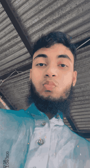a man with a beard is taking a selfie with the date 27/01/2020 on the bottom