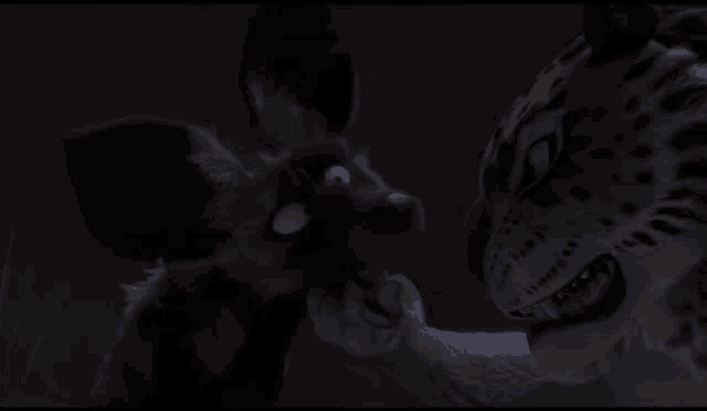 a cheetah and a wolf are looking at each other with their mouths open