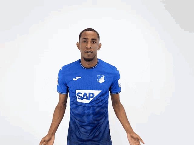 a man wearing a blue shirt with the word sap on the front